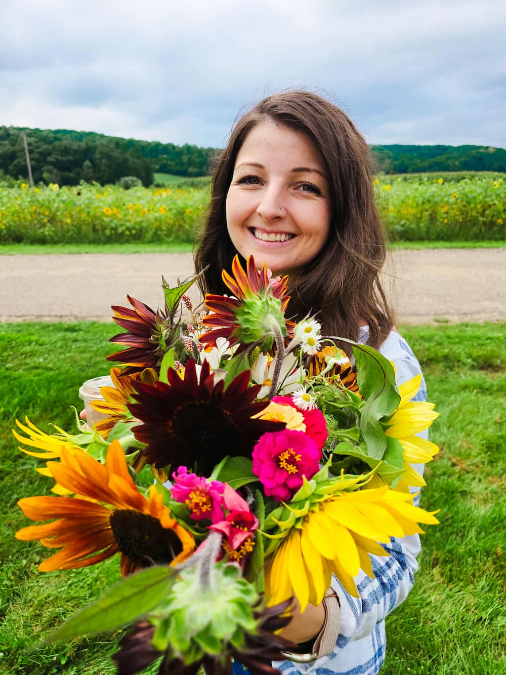 Woman holding a fresh bouquet from Fields and Fortune - Flower CSA Share